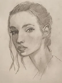 Graphite portrait sketch of a woman in three quarter view, hair pulled back into a bun with a few loose stands. Soft shading defines her features, with detailed eyes and lips on a lightly textured paper.