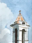 Watercolor sketch of a church tower seen from below, with a small cross on top. The building is painted with loose gray and warm orange shapes against a pale blue sky wash.