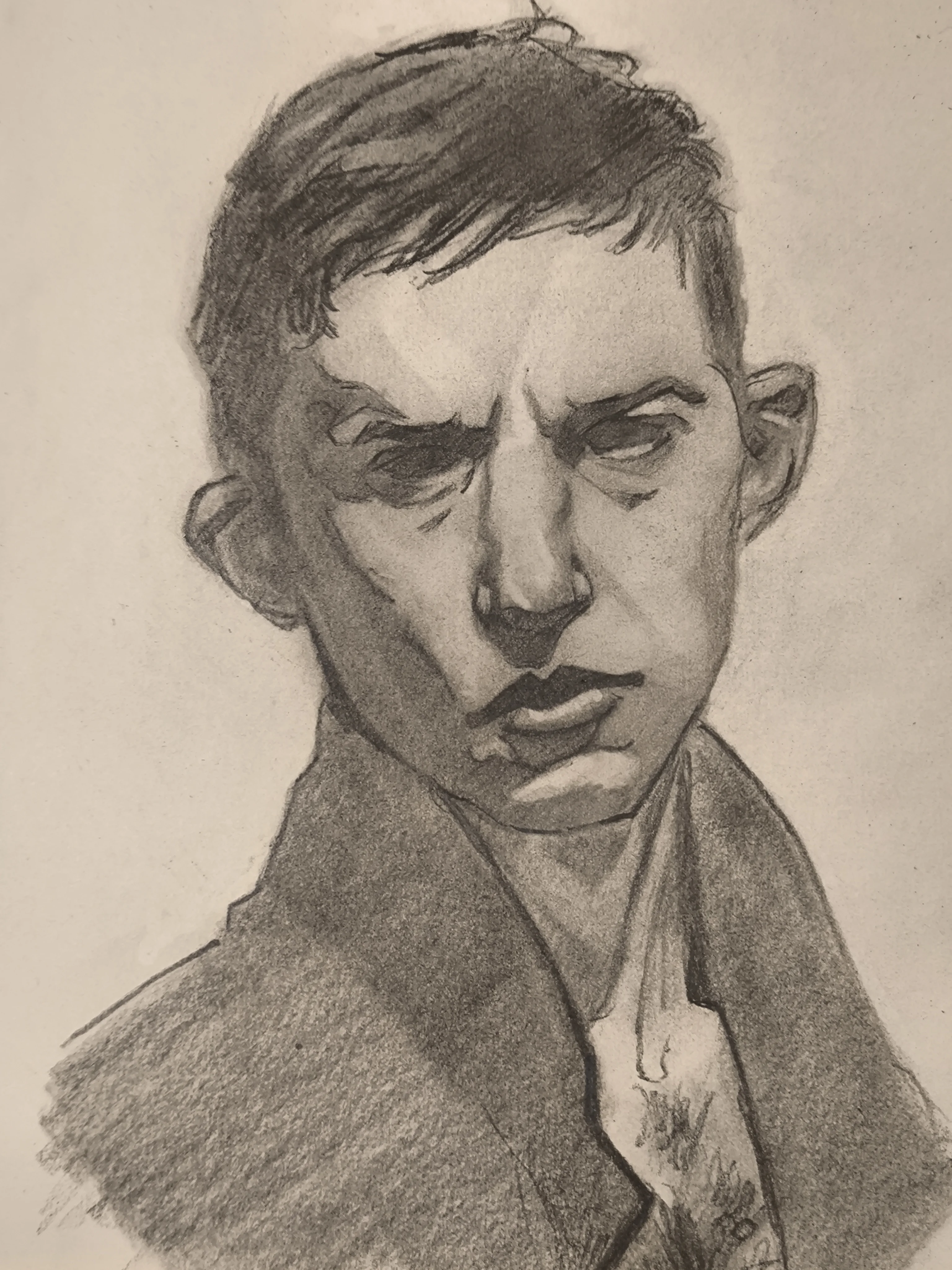 Graphite portrait sketch of a man with short dark hair and a serious, slightly annoyed expression. He is looking to the side, with strong shadows around the eyes and nose, and a coat collar framing the neck.