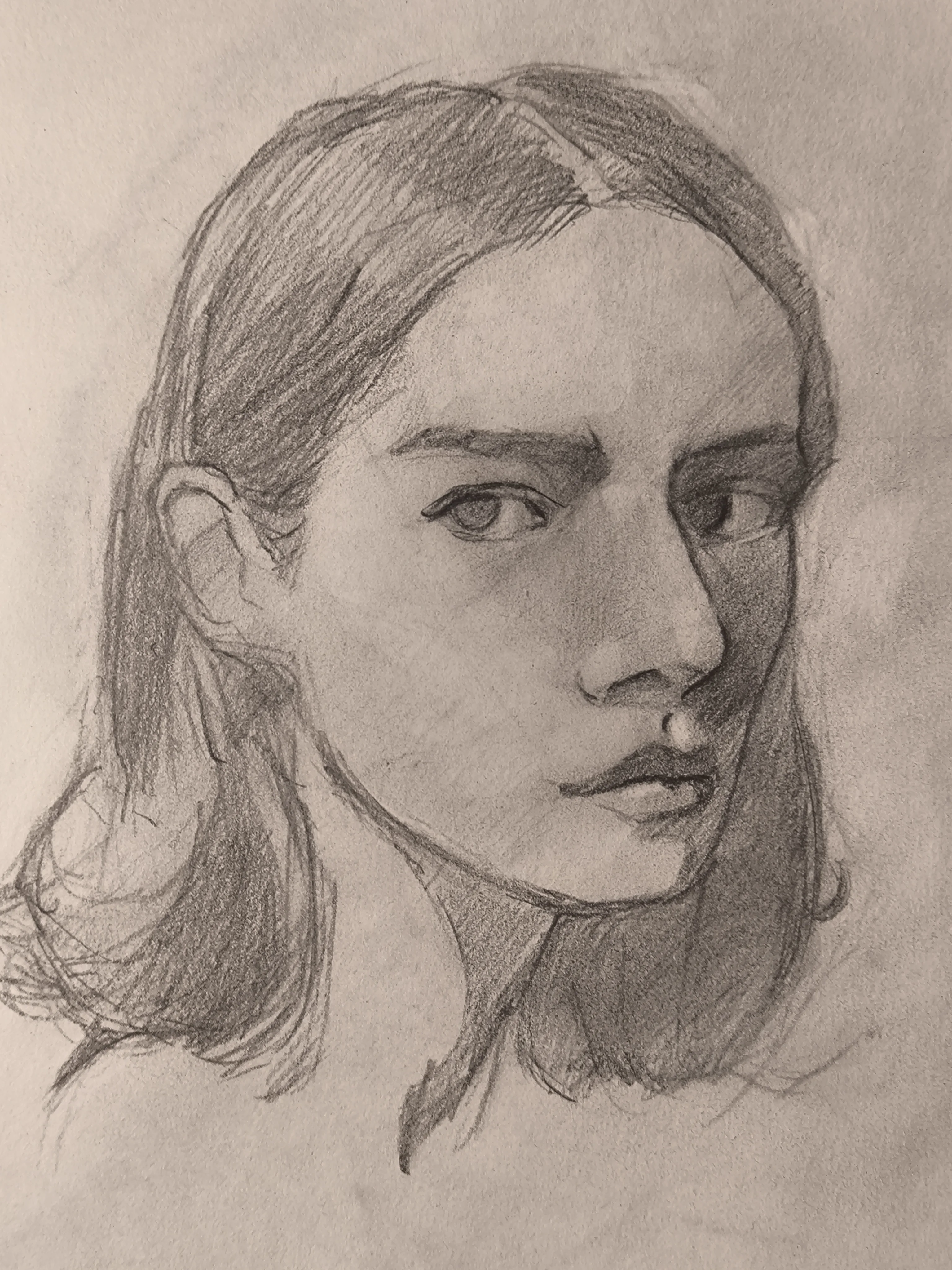Graphite portrait sketch of a young woman in 3/4 view, looking to the right. Her hair is parted in the middle and pulled back, with loose strands near the neck. Soft shading builds the cheek and nose, with a darker shadow covering the right side of her face and eye.