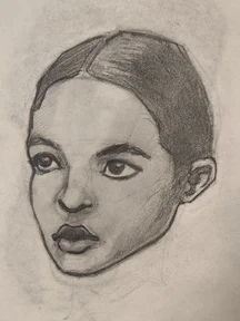 Graphite sketch of a woman’s head in 3/4 view. Hair is pulled back with a middle part, big eyes looking forward, and dark shaded lips. Soft shading on the cheek and jaw.