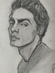 Graphite pencil portrait sketch of a young man in three quarter view, looking sideways with a sharp eyebrow and calm expression. Dark shaded hair swept back, strong jawline, and a shaded shirt.