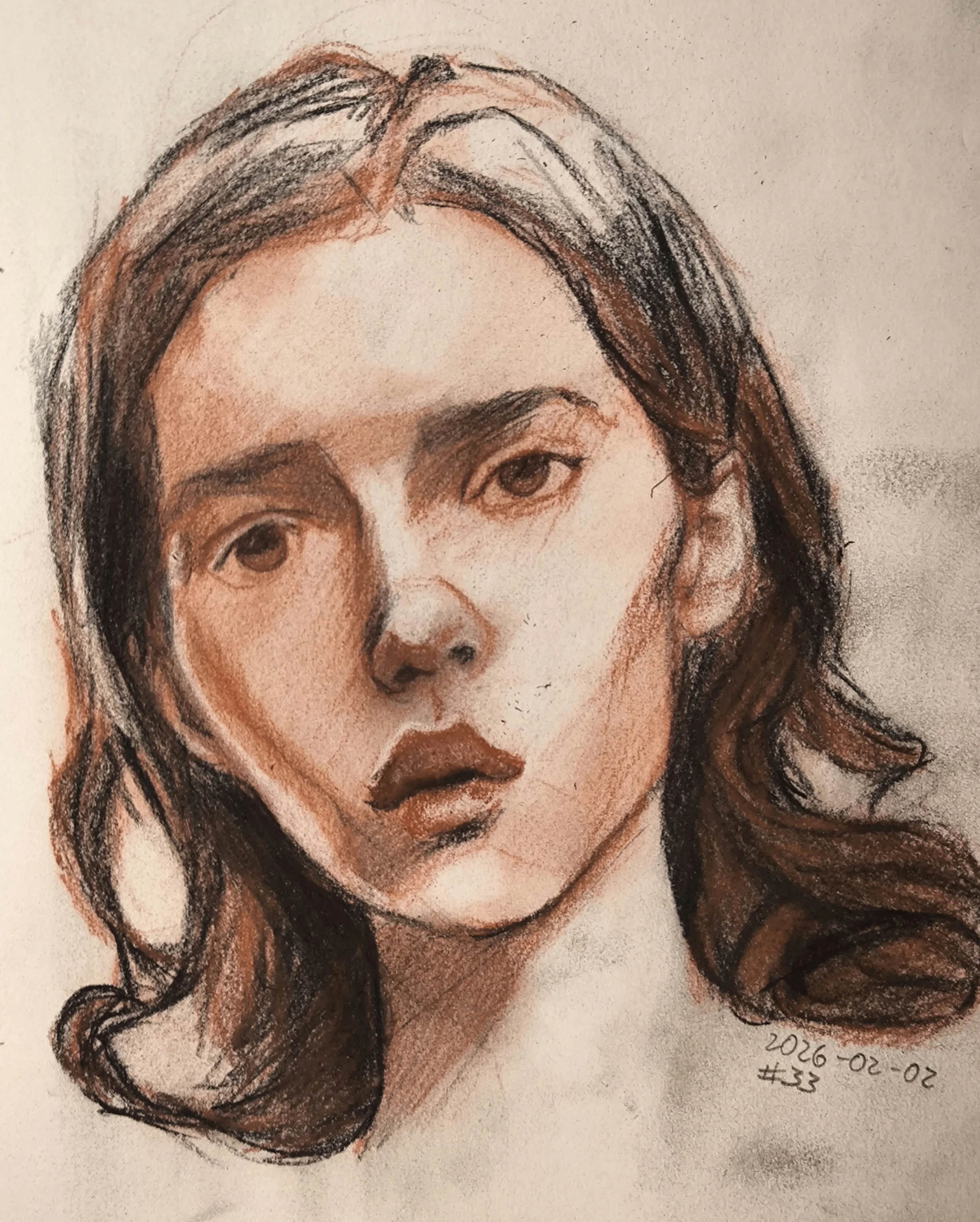 A loose portrait drawing of a young woman in three-quarter view, with wavy dark hair and a calm, slightly tired expression. Warm reddish shading and dark charcoal lines shape the face.