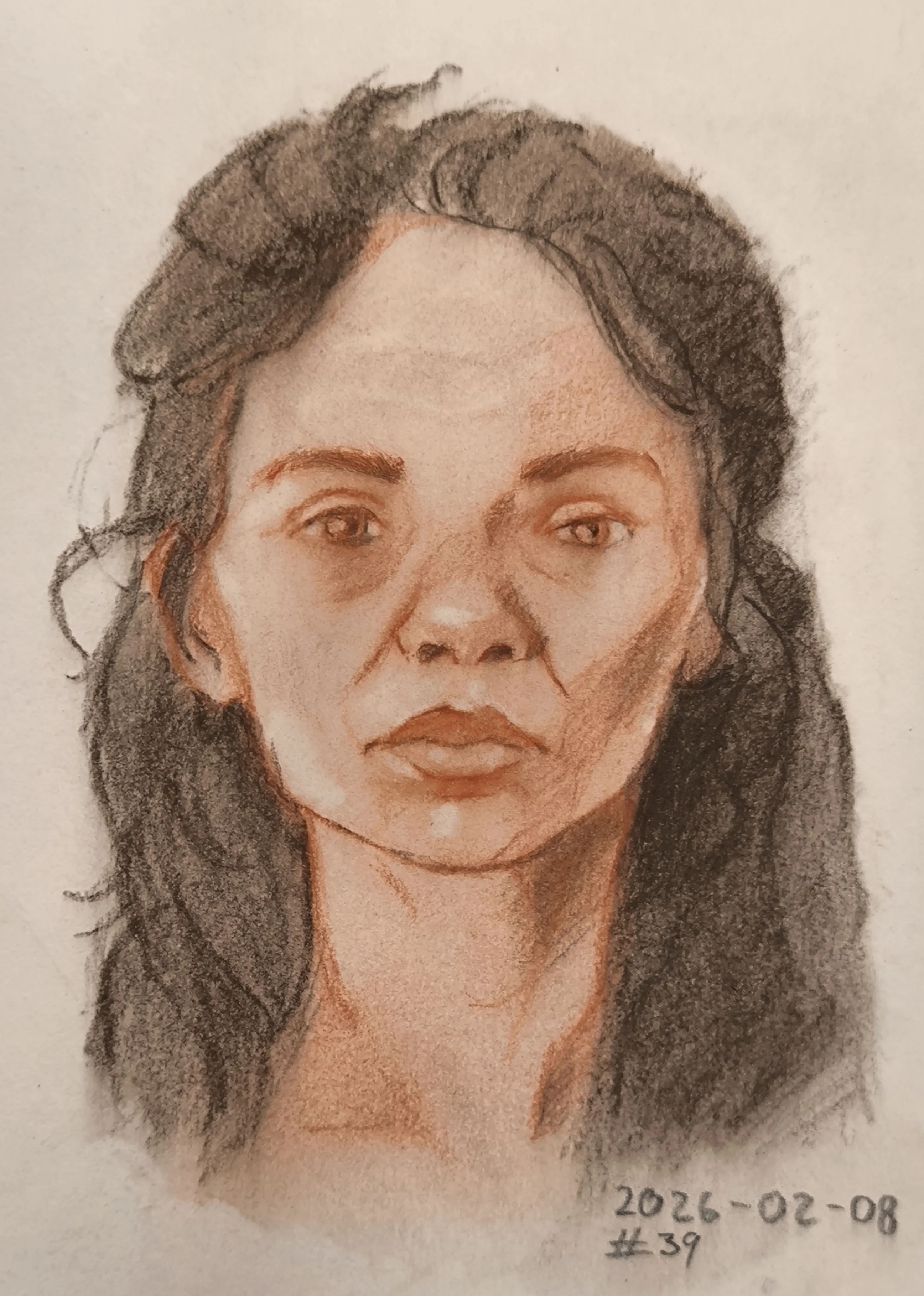 Portrait of a woman with dark wavy hair. The face is shaded with warm reddish tones and soft charcoal, looking slightly to the side with a calm, serious expression.