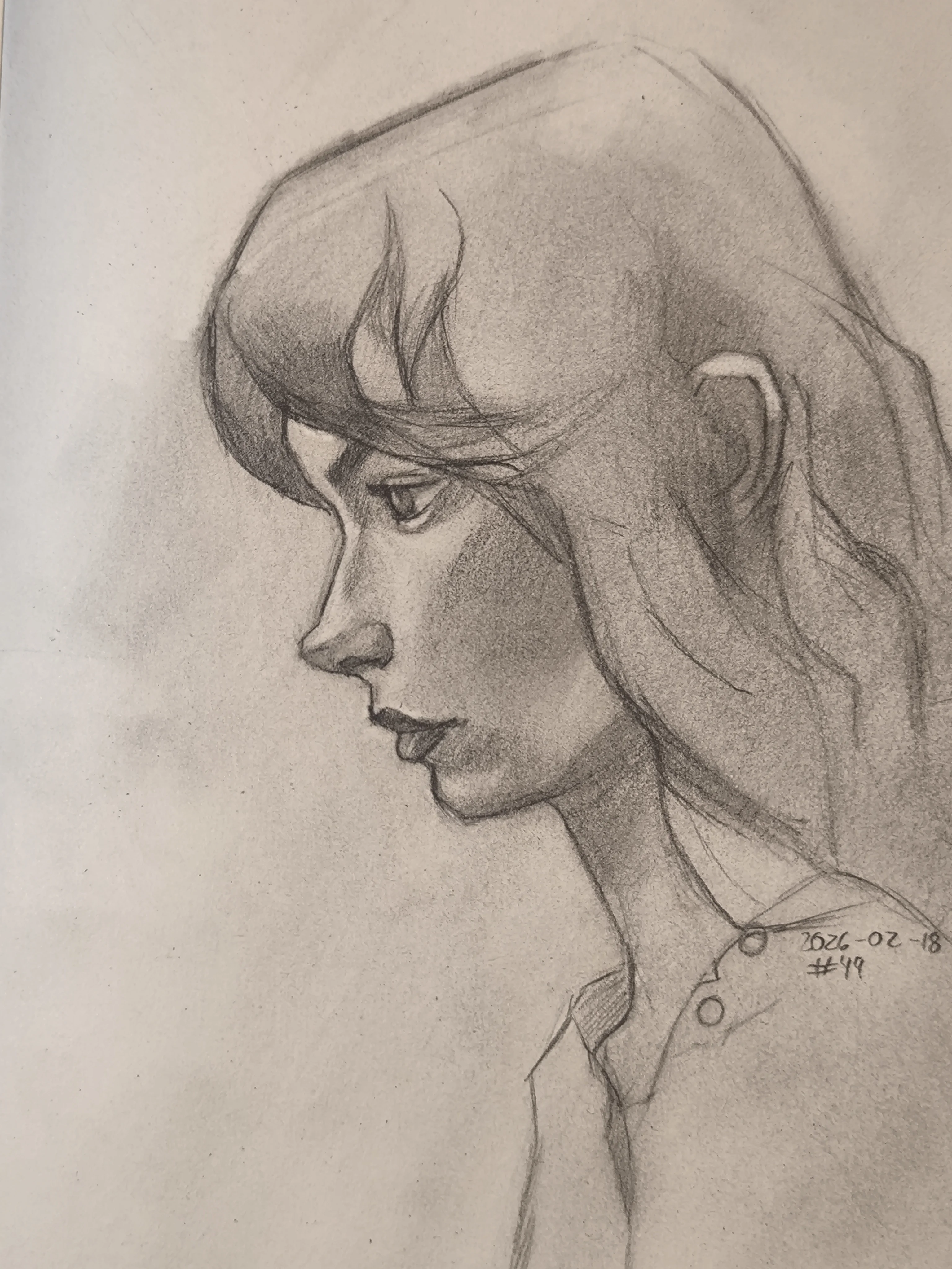 Graphite portrait sketch of a young woman in side profile, looking to the left. Soft shading on the cheek and jaw, with loose hair strands across the forehead and a simple shirt collar visible.