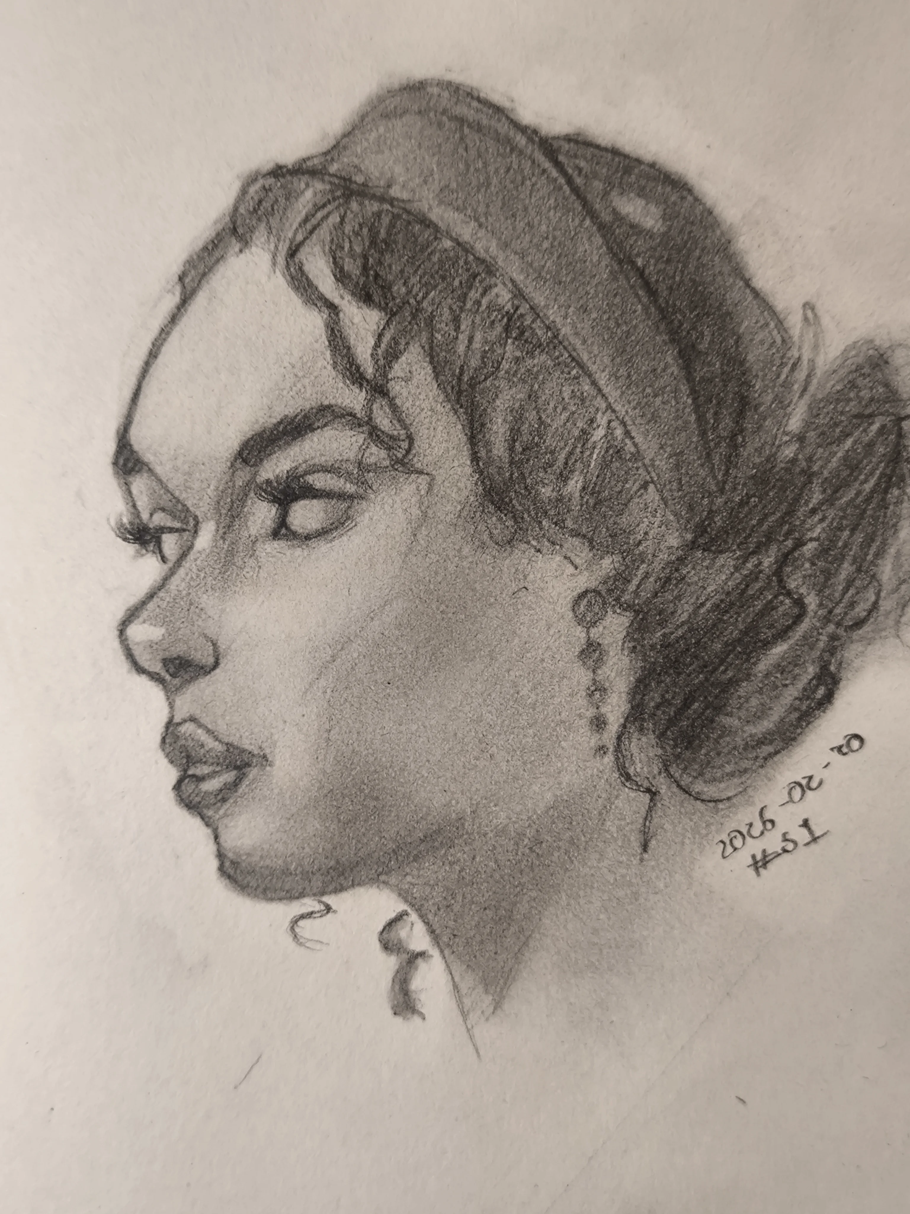 Side graphite portrait drawing of a young woman looking left, with a headband and her hair tied back in a messy bun. Soft shading on the cheek and neck, sharp eyelashes, and a dangling earring.